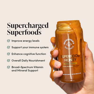 Superfood Honey in hand: Beekeeper's Naturals Superfood Honey with Propolis, Royal Jelly, & Bee Pollen for daily nourishment