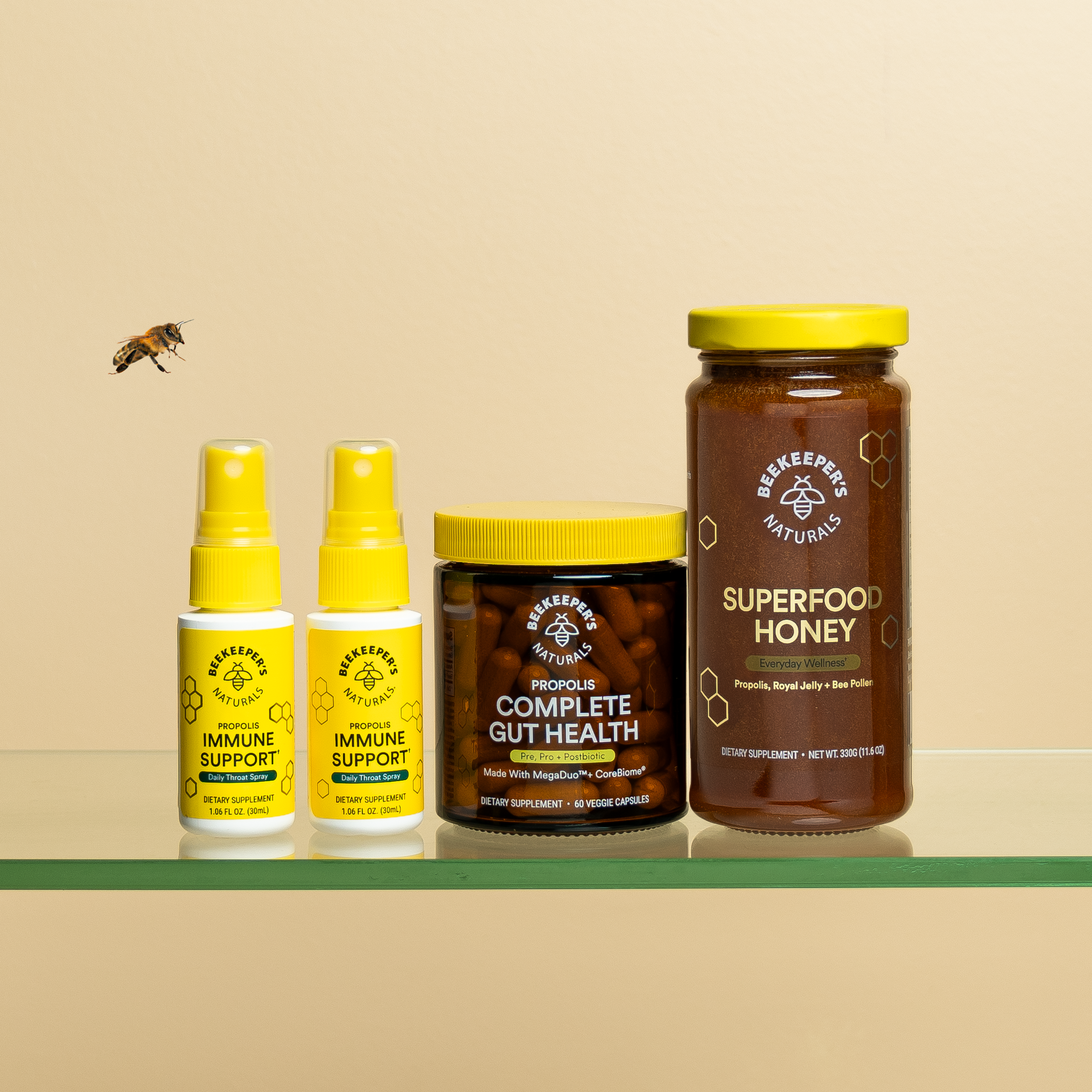 Beekeeper's Naturals "Ultimate Bundle" featuring Propolis Immune Support, Gut Health capsules, & Superfood Honey with bee.