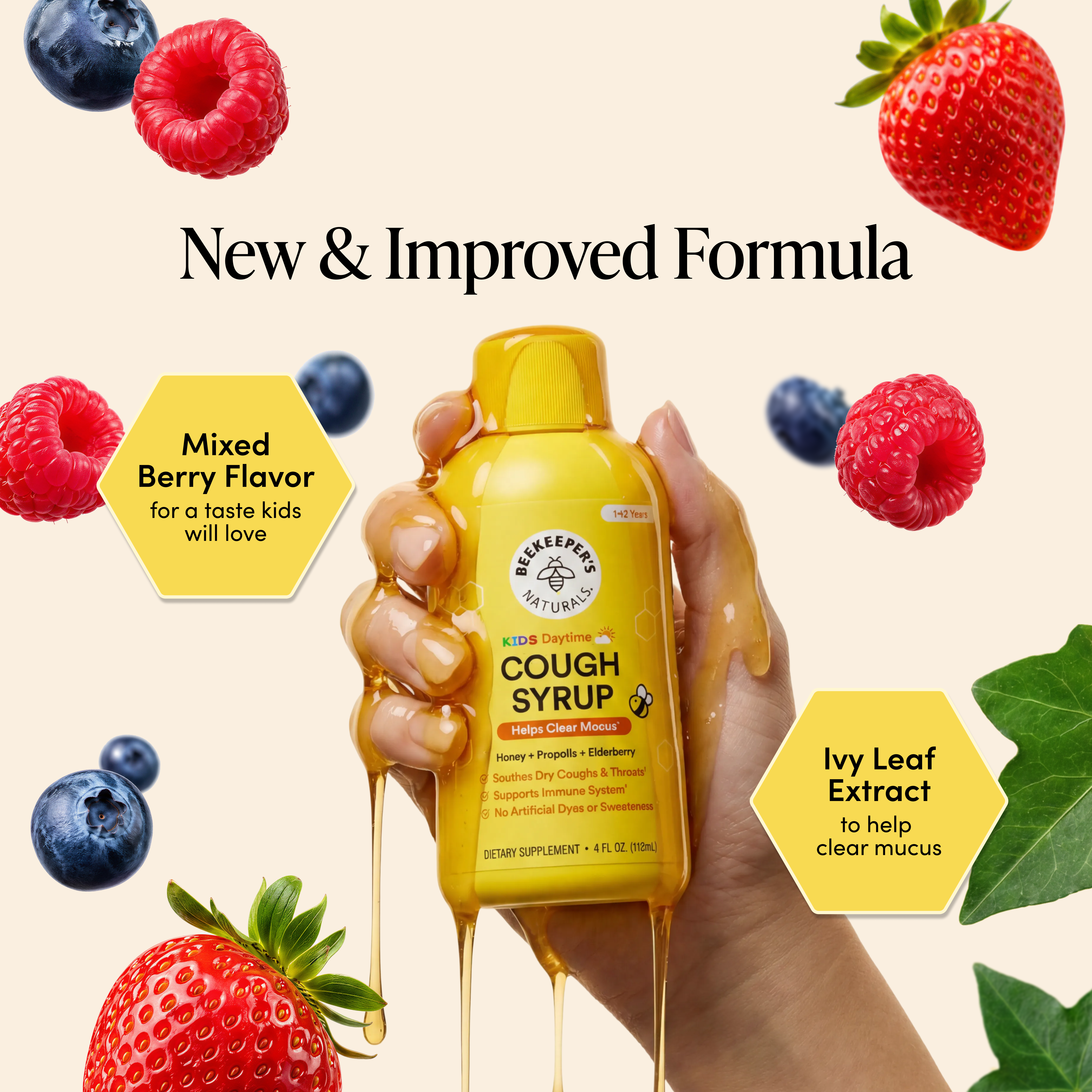 Hand holding a yellow cough syrup bottle with berries and leaves on a beige background