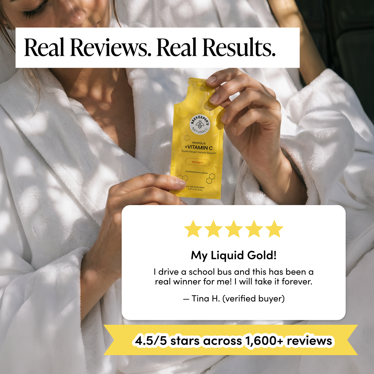 A woman in a white robe holds a small yellow packet of liquid vitamin C. The image includes promotional text reading 'Real Reviews.