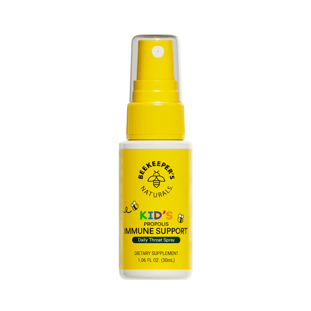 A yellow spray bottle labeled 'Kids Propolis Throat Spray' by Beekeeper's Naturals, marketed as a dietary supplement for immune support.