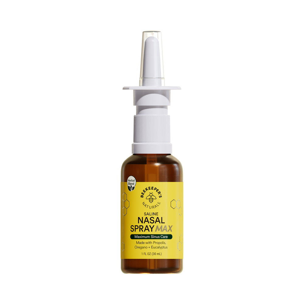 A bottle of Nasal Spray Max with a white spray nozzle on a transparent background, labeled with a yellow and green label.