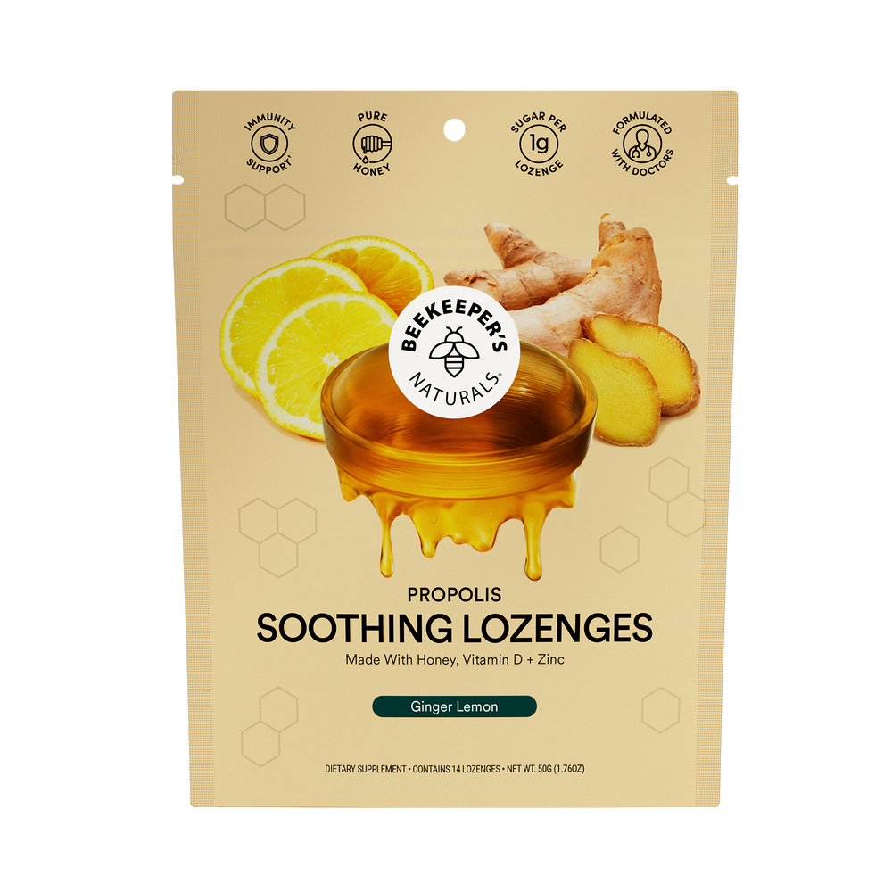 Packaging for Beekeeper's Naturals Propolis Soothing Lozenges with Ginger Lemon flavor. The box is colored yellow with images of propolis, honey, and lemons.
