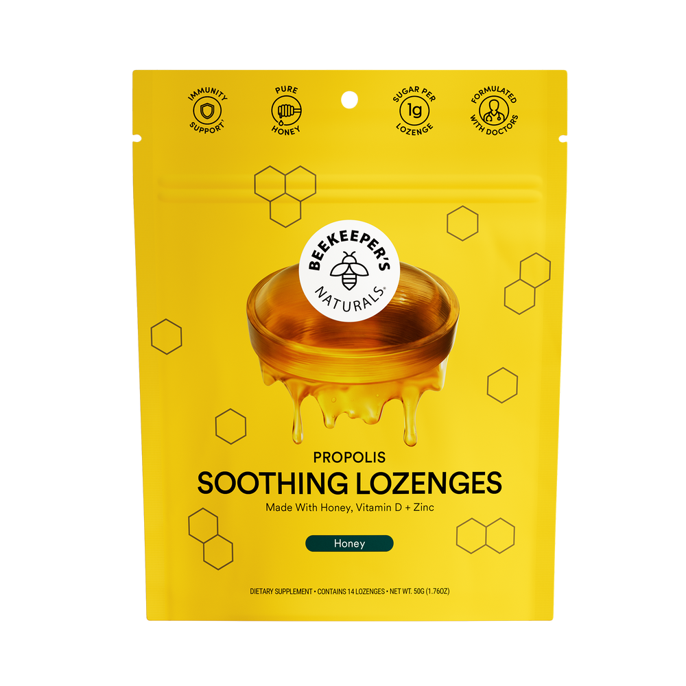 A package of Beekeeper's Naturals Propolis Soothing Lozenges with honey flavor, depicted with a background of yellow and hexagonal patterns, consistent with the brand's aesthetic.