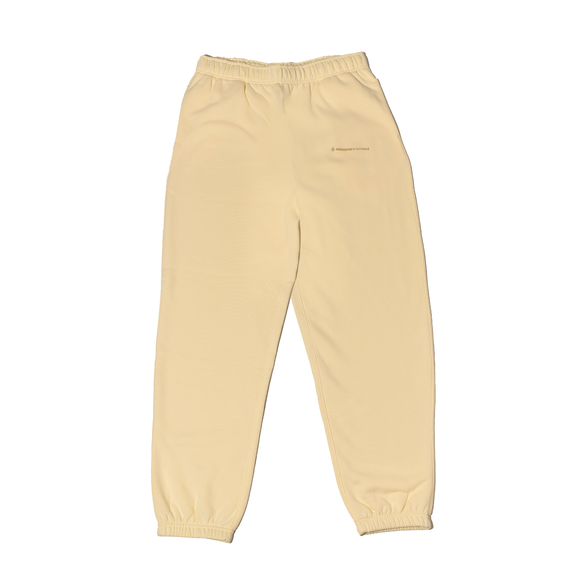 Cream sweatpants on a white background