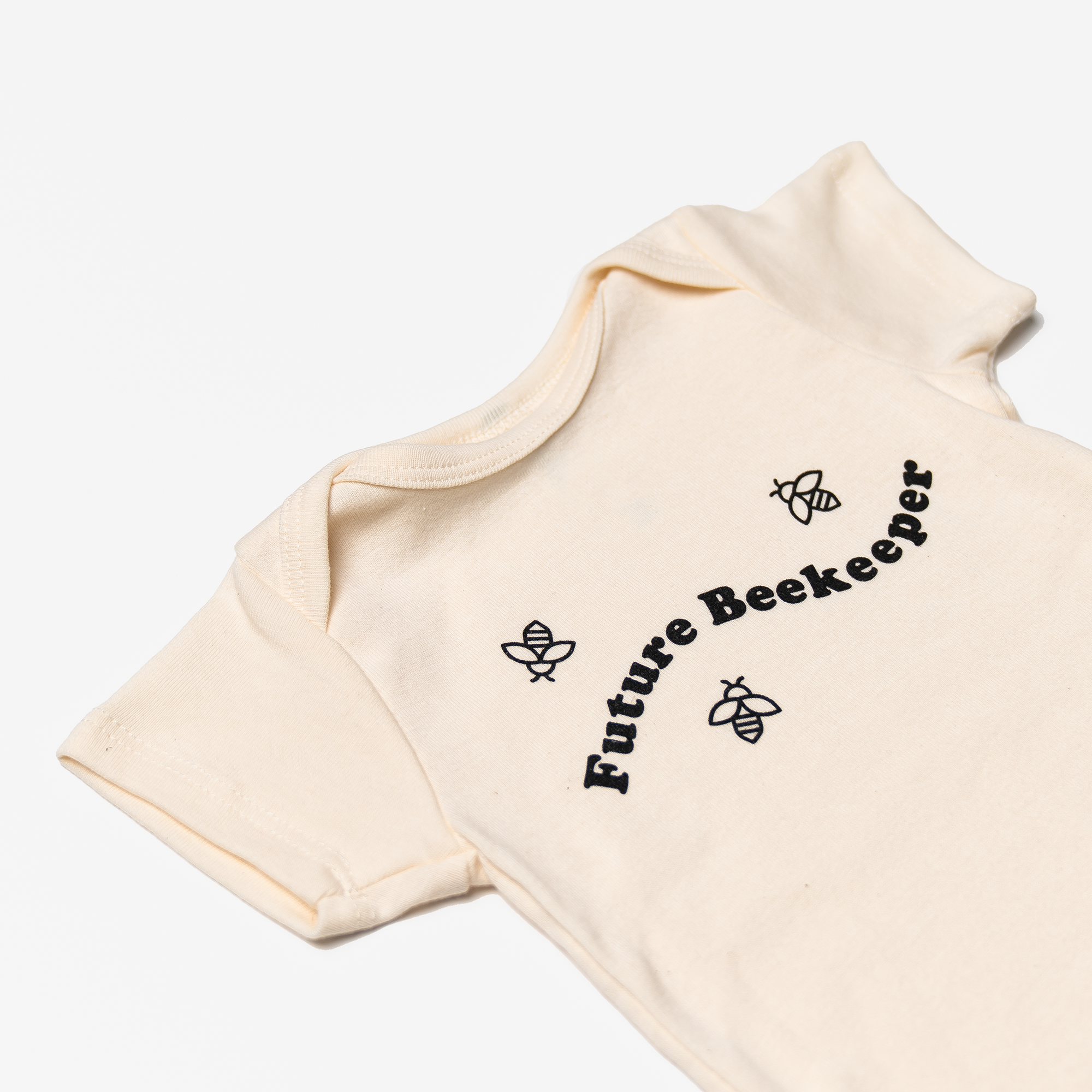 Baby onesie featuring "Future Beekeeper" text and bee illustrations, ideal for newborn apparel and unique baby gifts.