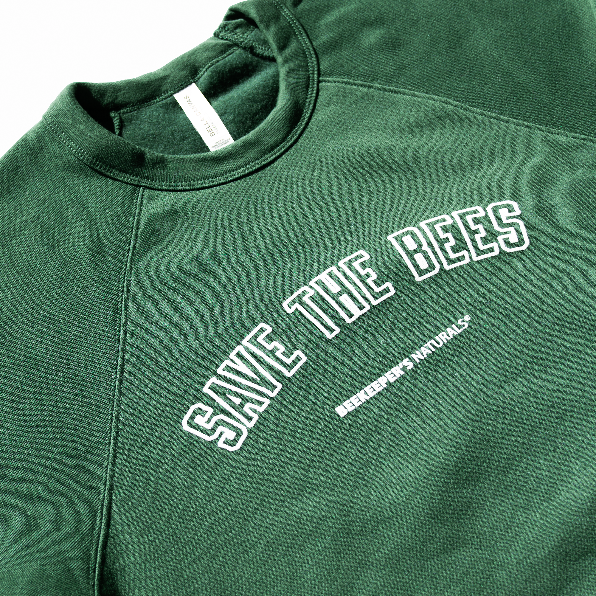 "Save The Bees Crew" juniors sweatshirt featuring the Beekeepers Naturals brand.