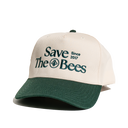 Save The Bees trucker hat detail. Embroidered text 'Save The Bees Since 2017' with bee graphic on a two-tone hat.