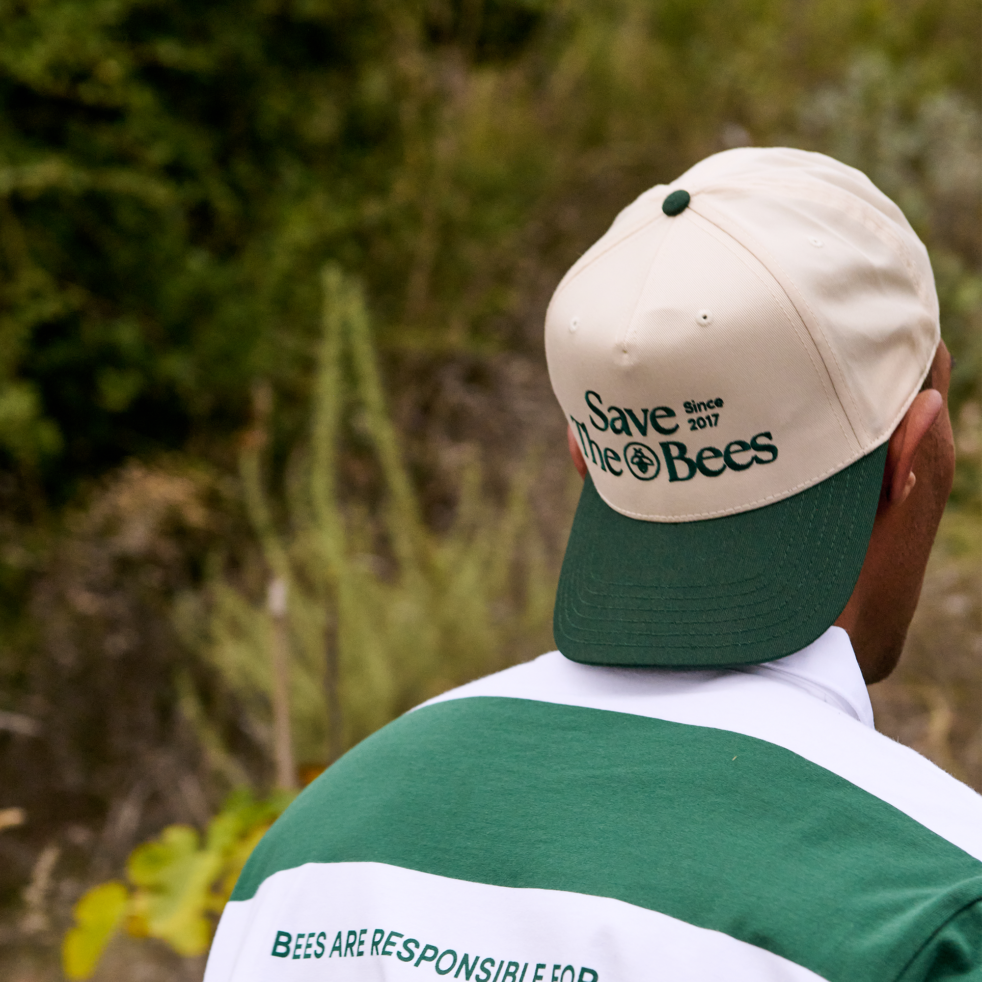 Back view of the Save The Bees Trucker Hat, featuring "Save the Bees Since 2017" text. Green brim.