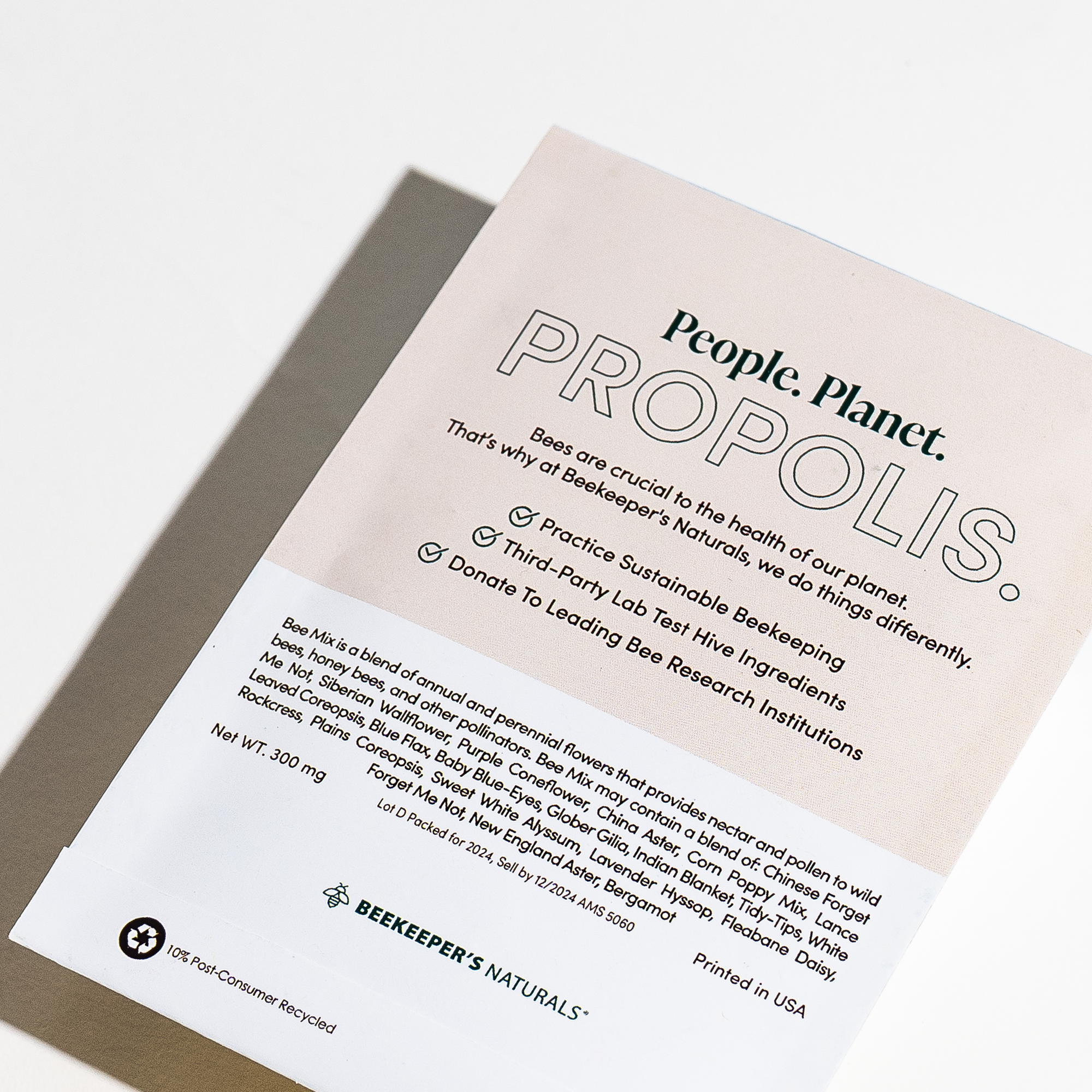 Beekeeper's Naturals Propolis seed packet, promoting sustainable beekeeping & bee-friendly flower mix ingredients. "People.