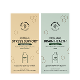 Two vertical supplement boxes from Beekeepers Naturals on a white background: Propolis Stress Support in beige and Royal Jelly Brain Health in pale green. Each box shows the brand logo, product name, ingredients, a bottle icon, and dosage information.