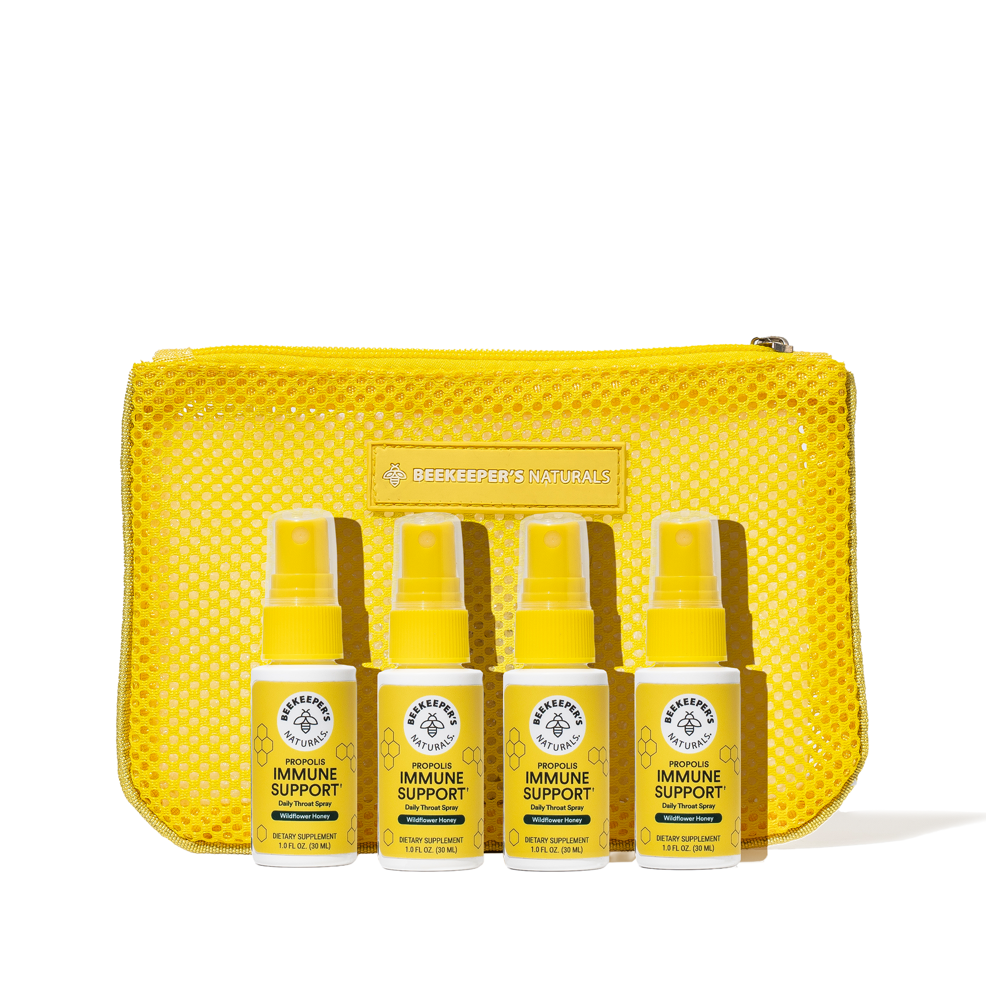 Set of yellow immune support products with a mesh pouch on a white background