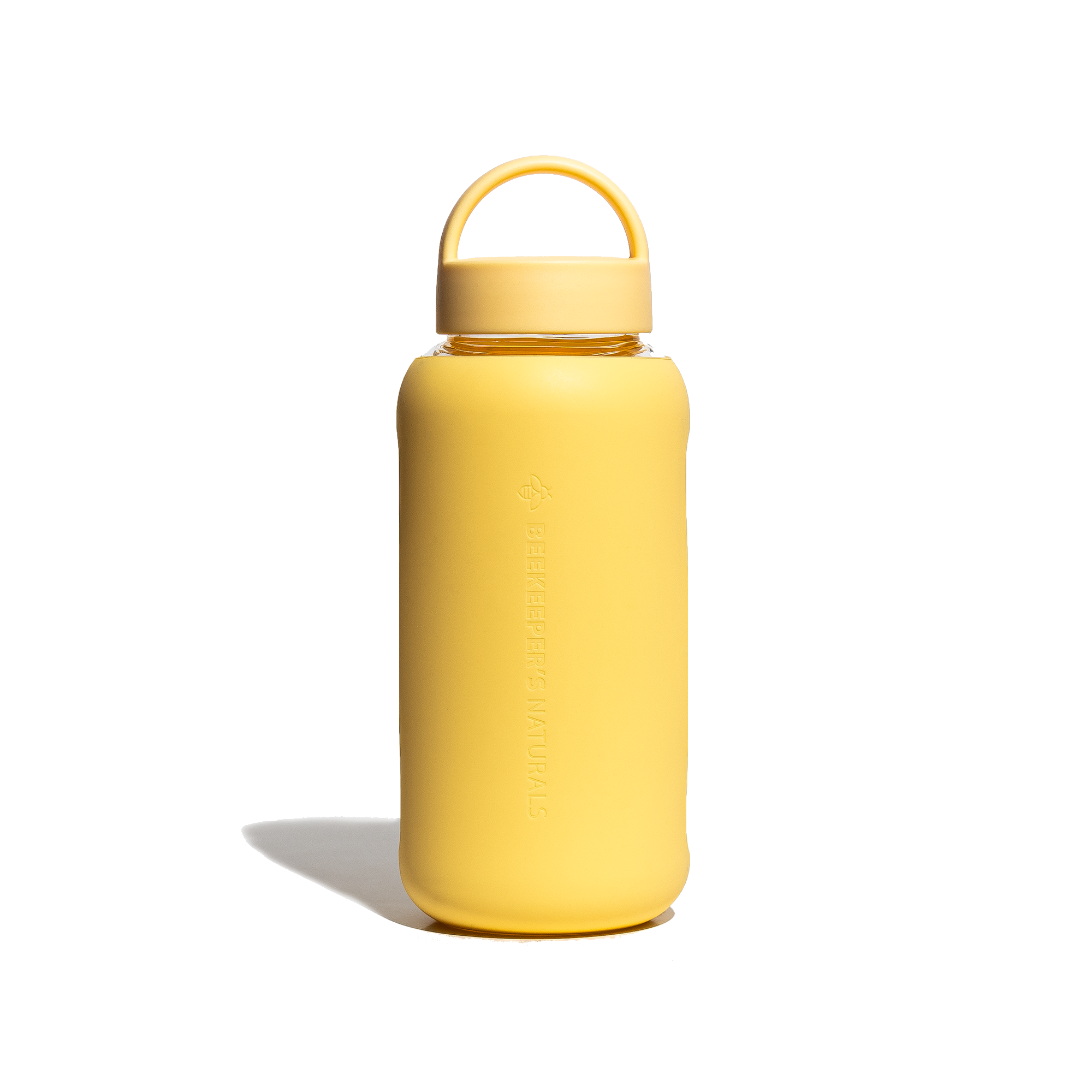 BKN Reusable Glass Water Bottle in yellow with carry handle. "Beekeepers Naturals" branding visible.