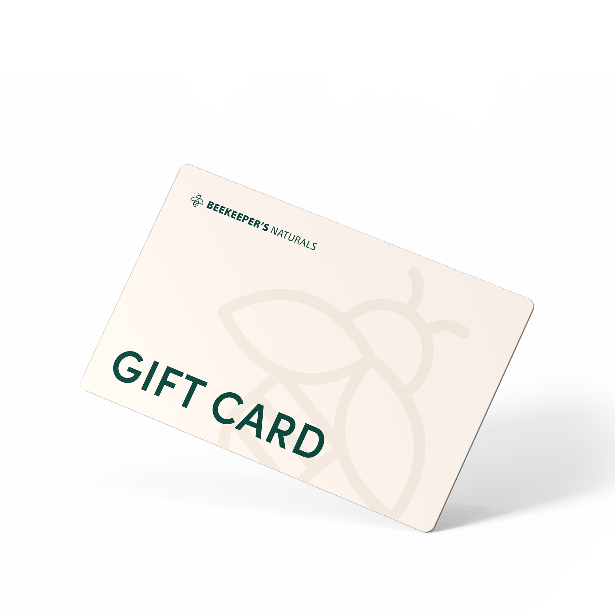 Angled view of Beekeeper's Naturals Hive gift card showing GIFT CARD text and botanical honeycomb pattern on cream background