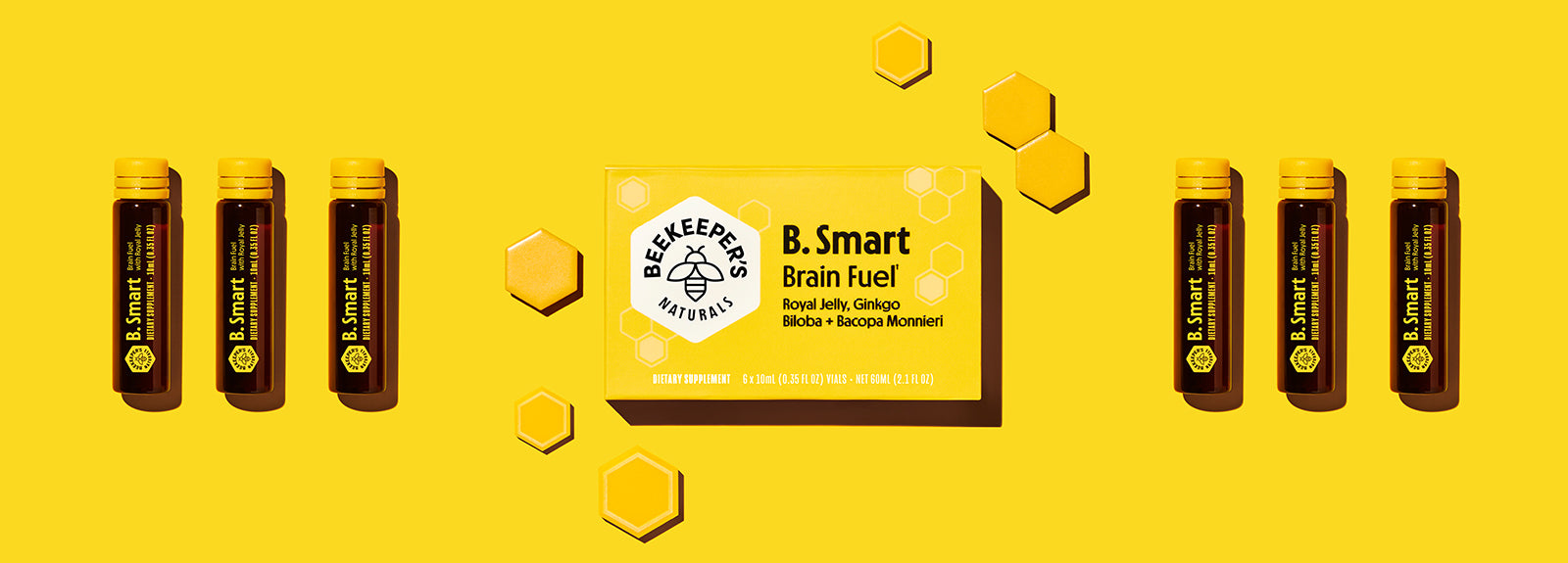 Front facing B.Smart Brain Fuel box with six glass ampoules showing yellow packaging and honeycomb accents on bright yellow background