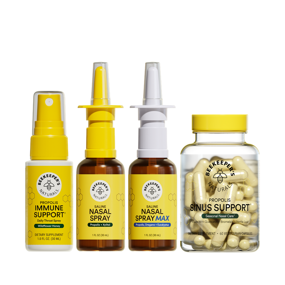 Collection of Beekeeper's Naturals health products including sprays and capsules on a translucent background