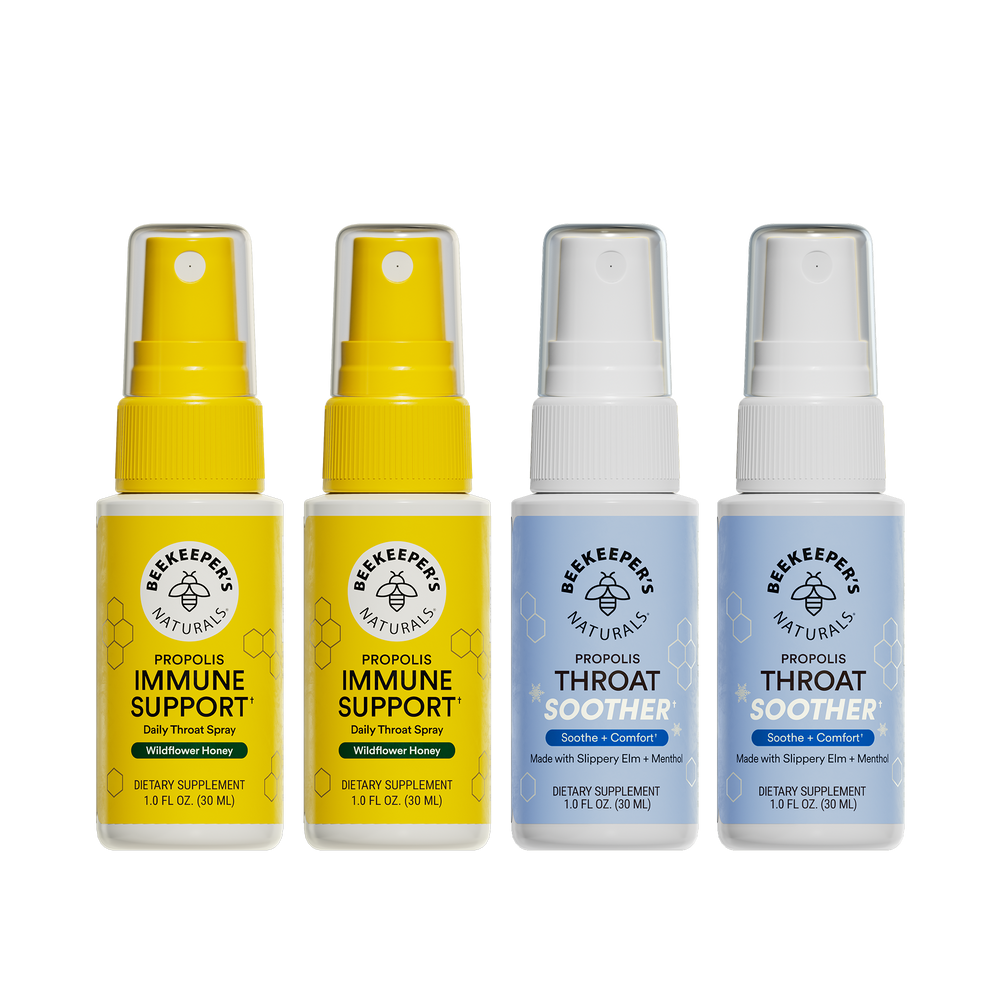 Two bottles of Beekeeper's Naturals Propolis Immune Support spray and two bottles of Throat Soother spray on a white background.