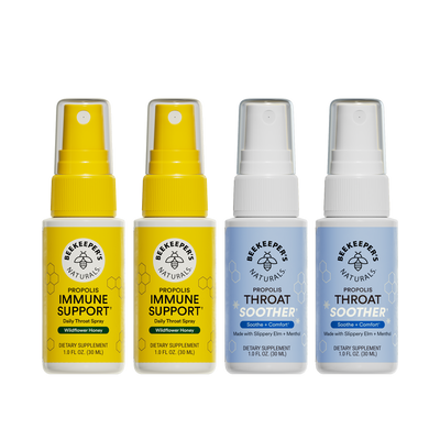 Two bottles of Beekeeper's Naturals Propolis Immune Support spray and two bottles of Throat Soother spray on a white background.