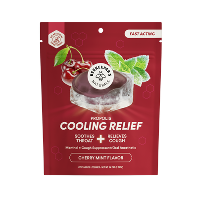 A red stand-up pouch of Bee Keeper Naturals Propolis Cooling Relief Cherry Mint Flavor, featuring a graphic of a cherry, mint leaves, and an ice cube with a dark purple propolis coating, on a white background.