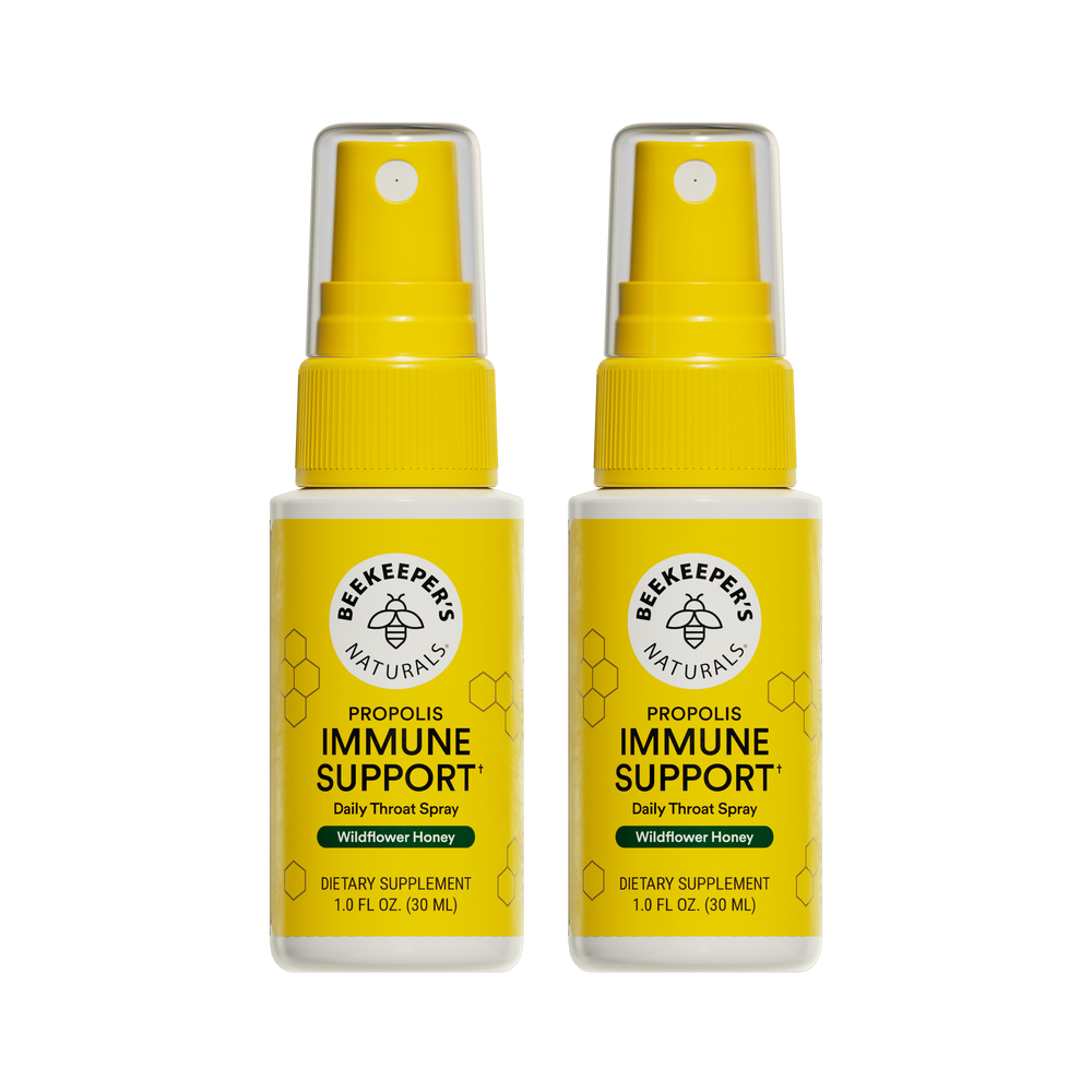 Two bottles of Beekeeper's Naturals Propolis Immune Support daily throat spray on a white background