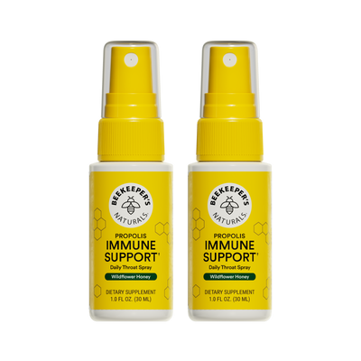 Two bottles of Beekeeper's Naturals Propolis Immune Support daily throat spray on a white background