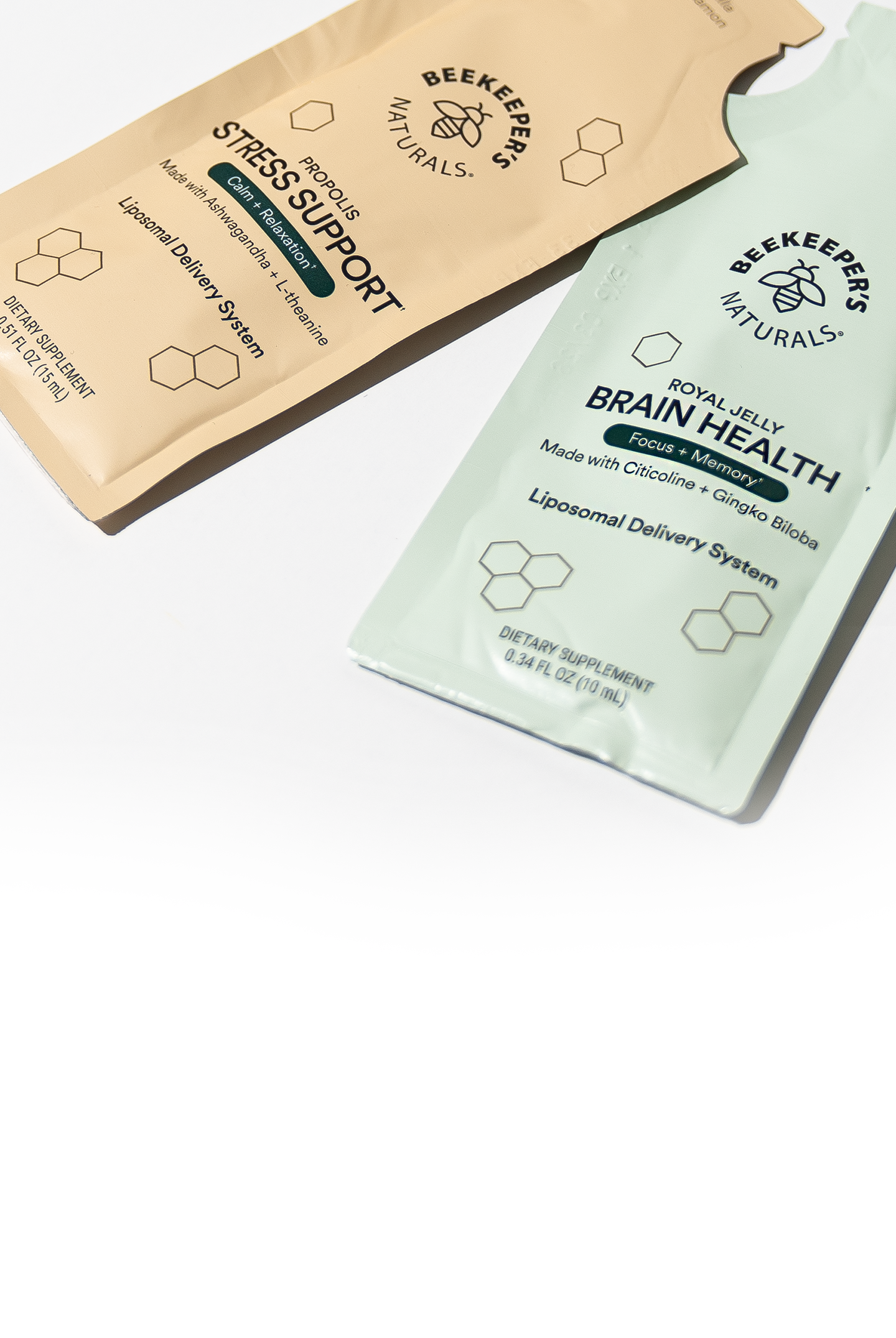 Two packages of Beekeeper's Natural products on a white background