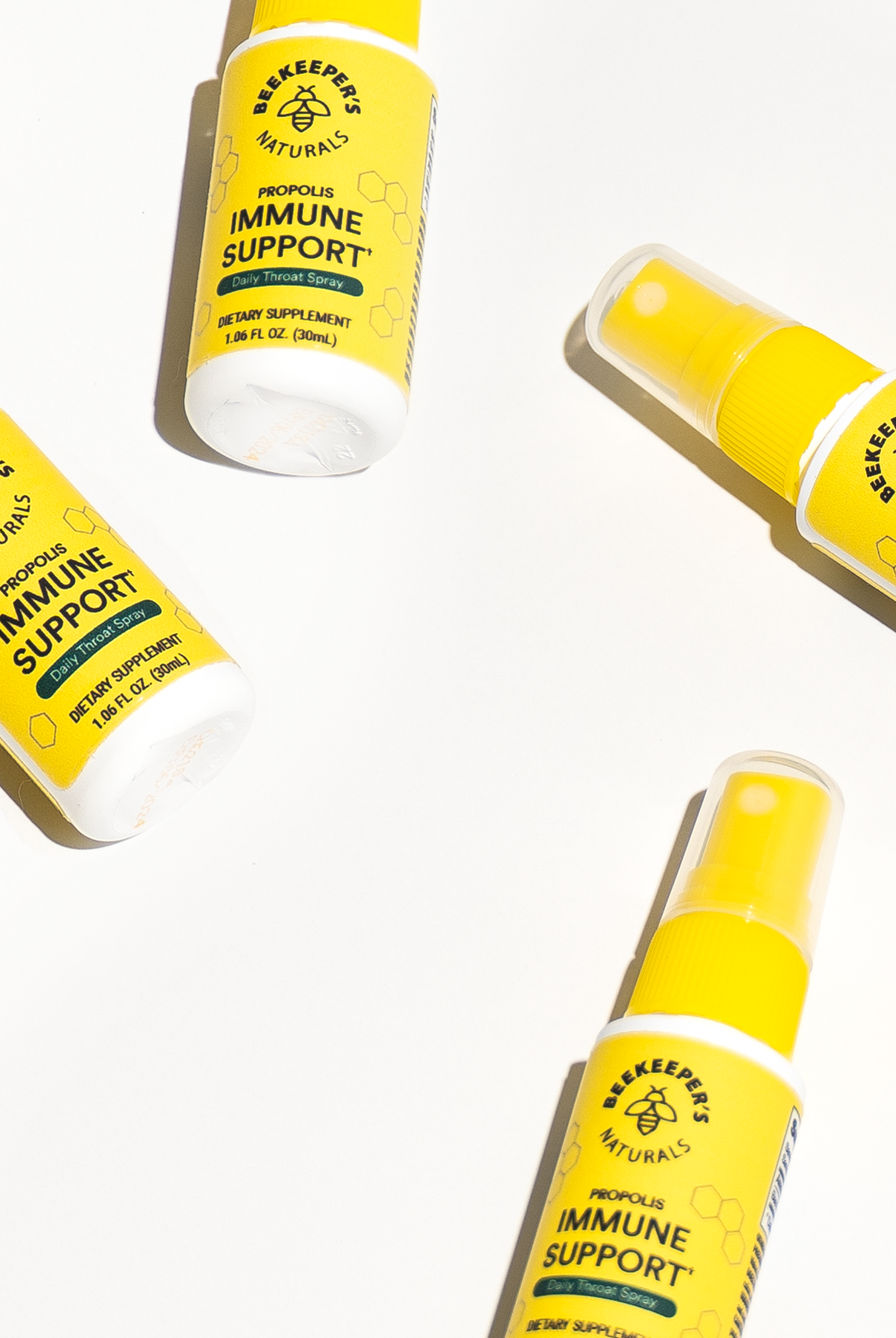 Multiple bottles of immune support supplement on a white background