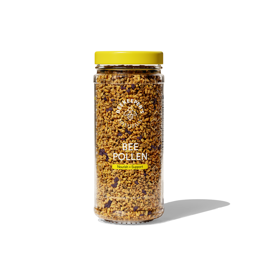 Jar of Beekeeper's Naturals bee pollen, a natural dietary supplement for nourishment and support. Text on label: "Bee