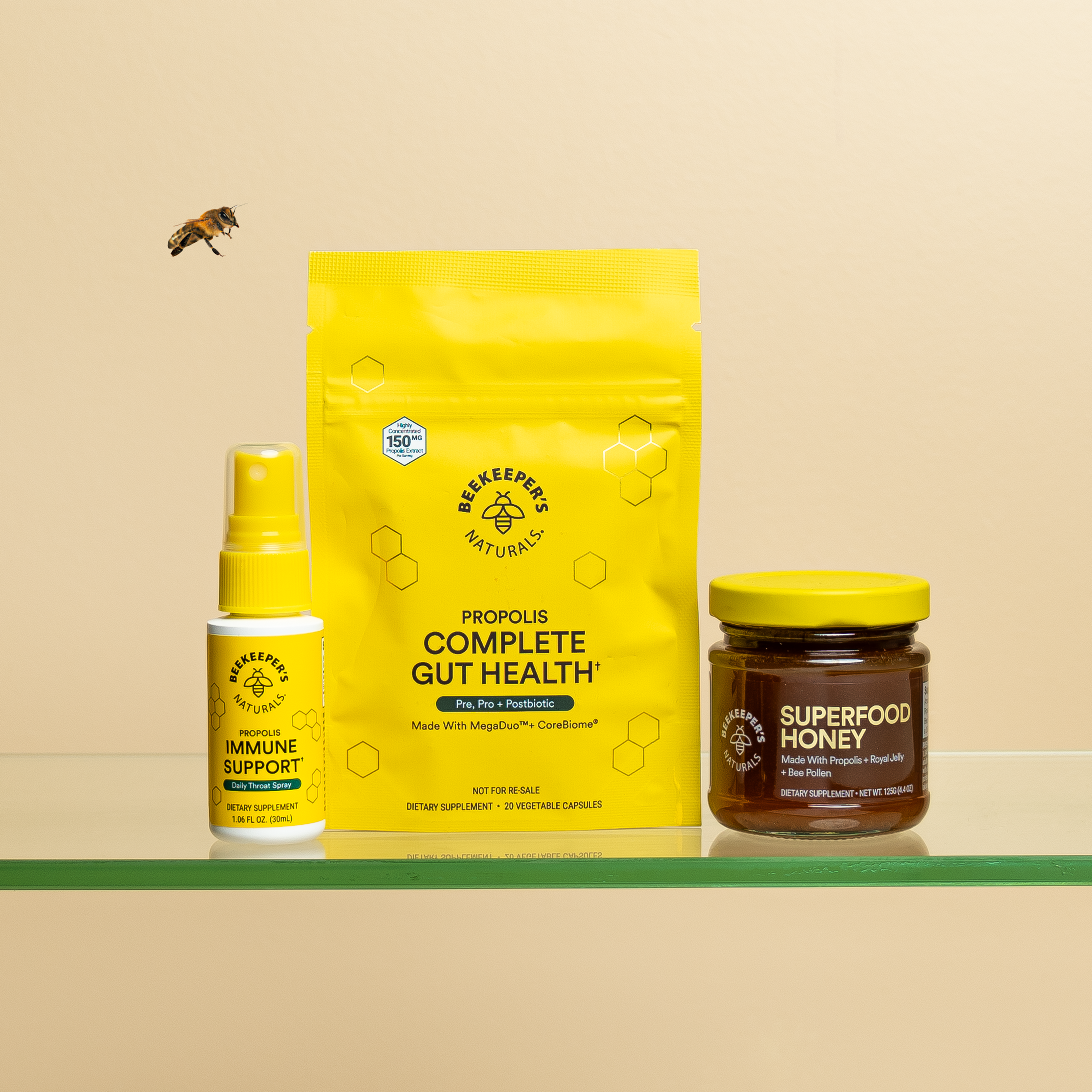 Beekeeper's Naturals starter bundle: Propolis immune support spray, gut health capsules, and superfood honey.