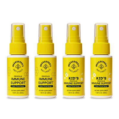 Four yellow bottles of Beekeeper's Naturals immune support products on a white background