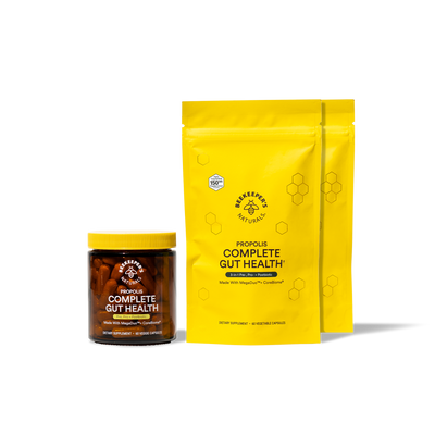 Two yellow packages of Bee & Honey Naturals Complete Gut Health on a white background