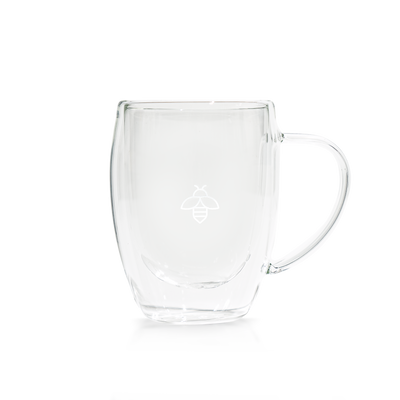 BKN Mug showcasing its double-walled clear glass design. The lightweight cup with a bee logo ensures ideal insulation.