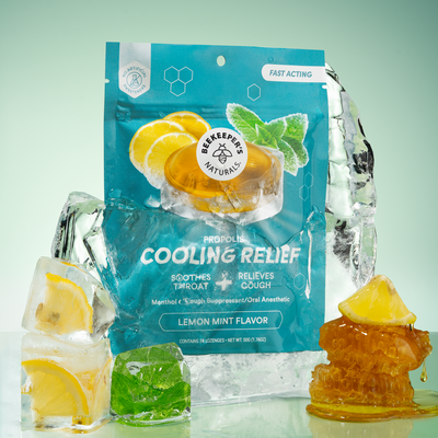 Front view of Lemon Mint Cooling Relief Lozenges pouch labeled Propolis Cooling Relief with lemon, mint, ice, and honey