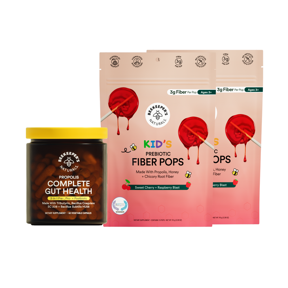 Jar of 'Complete Gut Health' supplement and package of 'Kid's Prebiotic Fiber Pops' on a white background