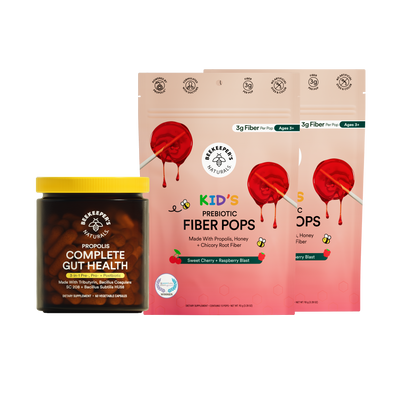 Jar of 'Complete Gut Health' supplement and package of 'Kid's Prebiotic Fiber Pops' on a white background