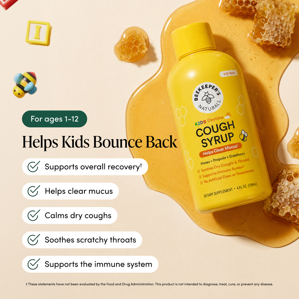 Beekeeper's Naturals Kids' Cough Syrup bottle with honeycomb and honey on a beige background