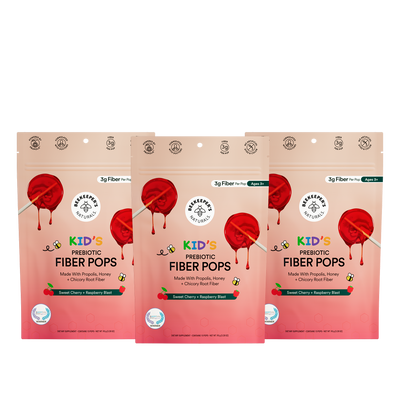 Three packages of Kids' Prebiotic Fiber Pops on a white background