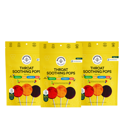 Three packages of Beekeepers Naturals Throat Soothing Pops on a white background