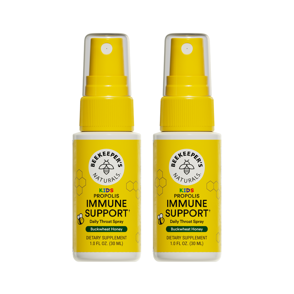 Two bottles of Beekeeper's Naturals Kid's Propolis Immune Support daily throat spray on a white background