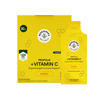 A yellow box and matching single-use pouch of Beekeeper Naturals Propolis + Vitamin C supplement, labeled Honey, on a plain white background.