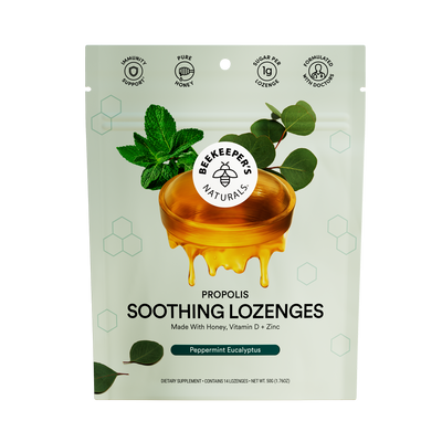 Packaging for Beekeeper's Naturals Propolis Soothing Lozenges with an image of a honeycomb and leaves, indicating a natural product.