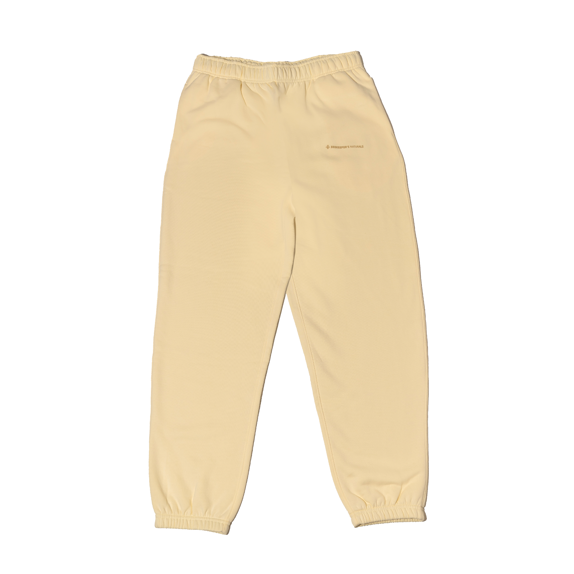 Cream sweatpants on a white background
