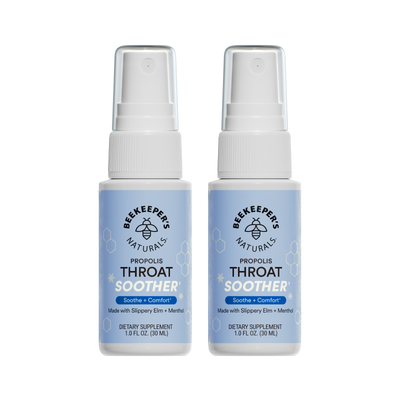 Two bottles of Beekeeper's Naturals Propolis Throat Soother on a white background