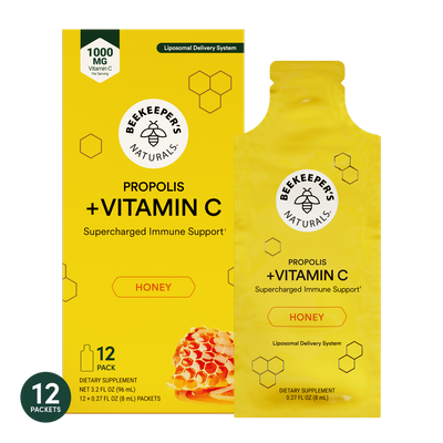 Two yellow packages of Beekeeper's Naturals Propolis + Vitamin C supplement on a white background.