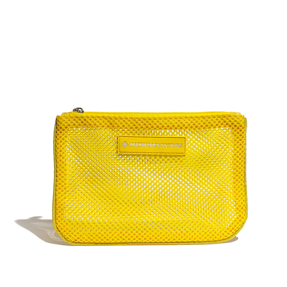 Yellow mesh pouch from Beekeepers Naturals. Great for travel, organizing small items, or carrying essentials.
